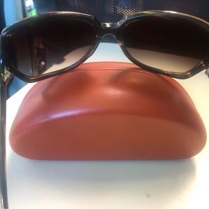 used ladies glasses medium use with minimal details. size small color brown.